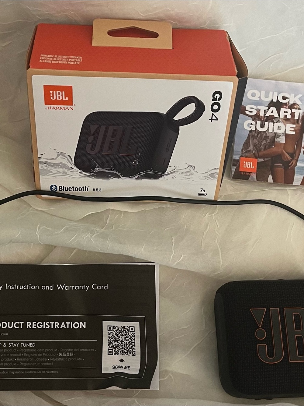 JBL GO 4 Portable Bluetooth Speaker - Black with Copper Logo Accent